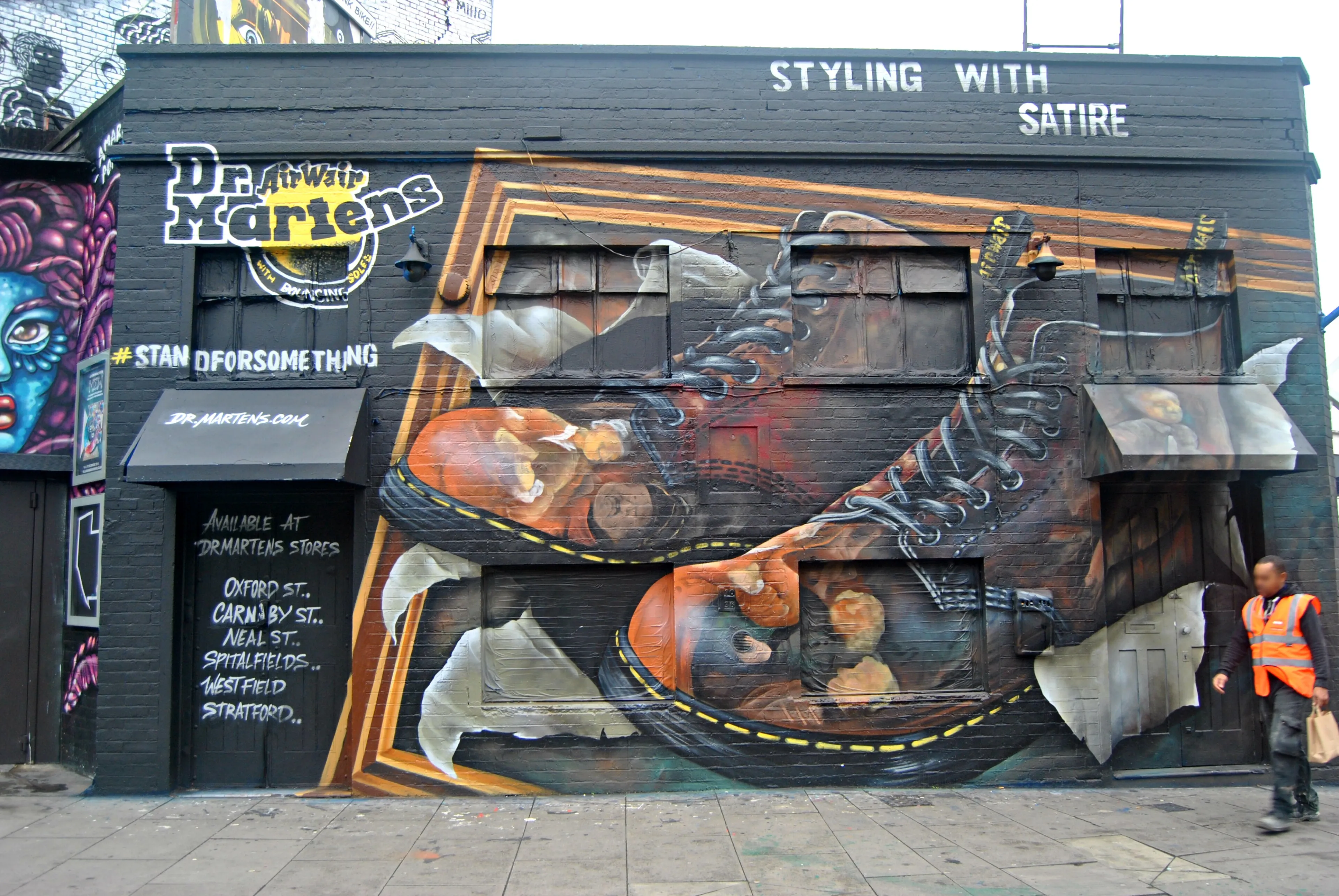 A large boot mural painted on a building in Shoreditch